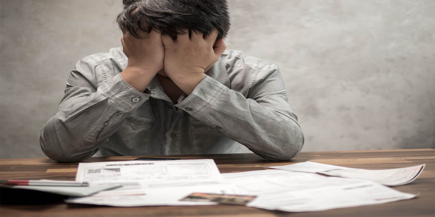 Frustrated man facing foreclosure - reasons to sell before foreclosure
